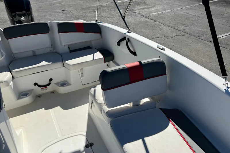 Slide: The Image of 2022 Tahoe T18 boat interior with cushioned seating and modern design. - 15