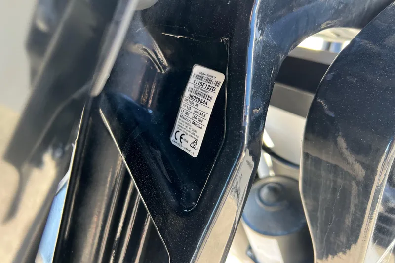 Slide: The Image of Close-up of a 2022 Tahoe T18 label on a black surface. - 23