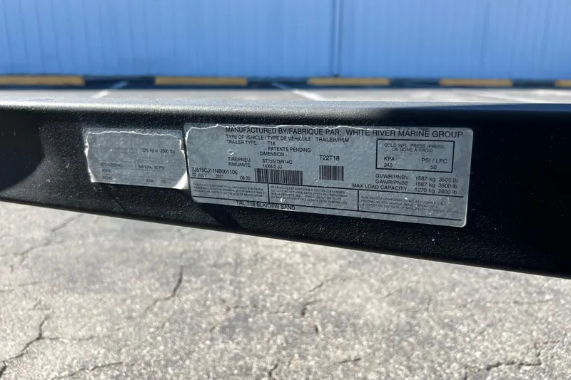 Slide: The Image of Label on 2022 Tahoe T18 trailer by White River Marine Group, showing specifications. - 24