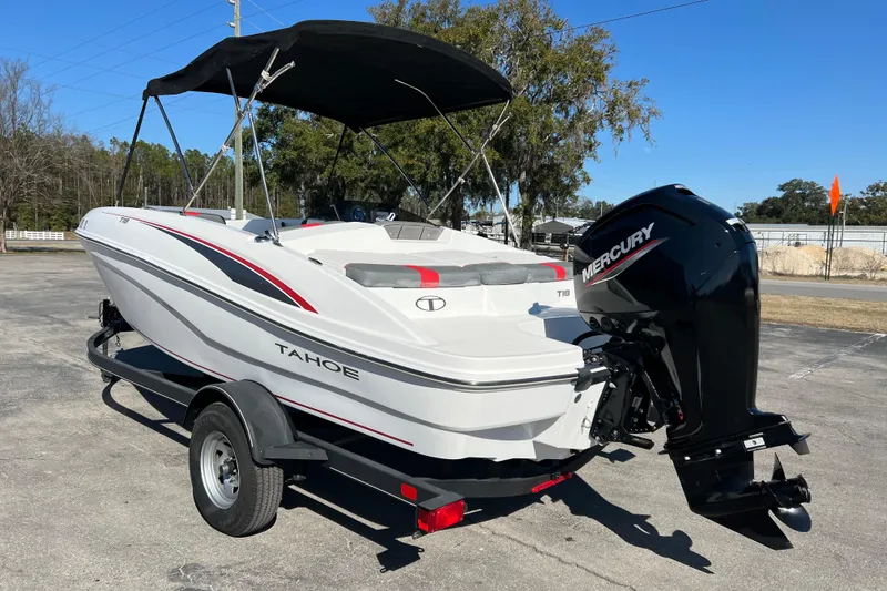 Slide: The Image of 2022 Tahoe T18 boat with Mercury engine on trailer, parked outdoors. - 3