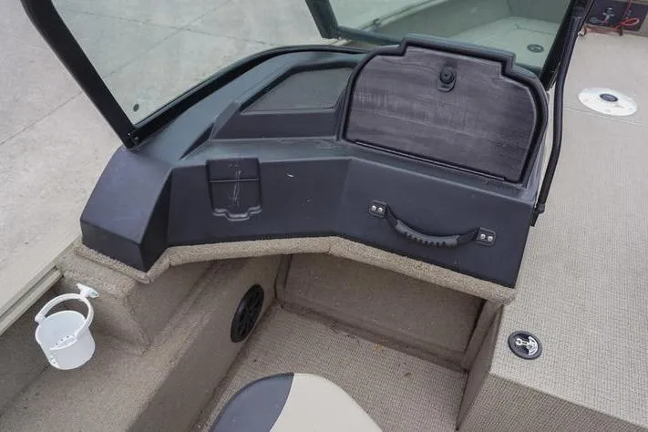 Slide: The Image of 2021 G3 Angler V21 F boat dashboard with storage compartment and cup holder. - 10