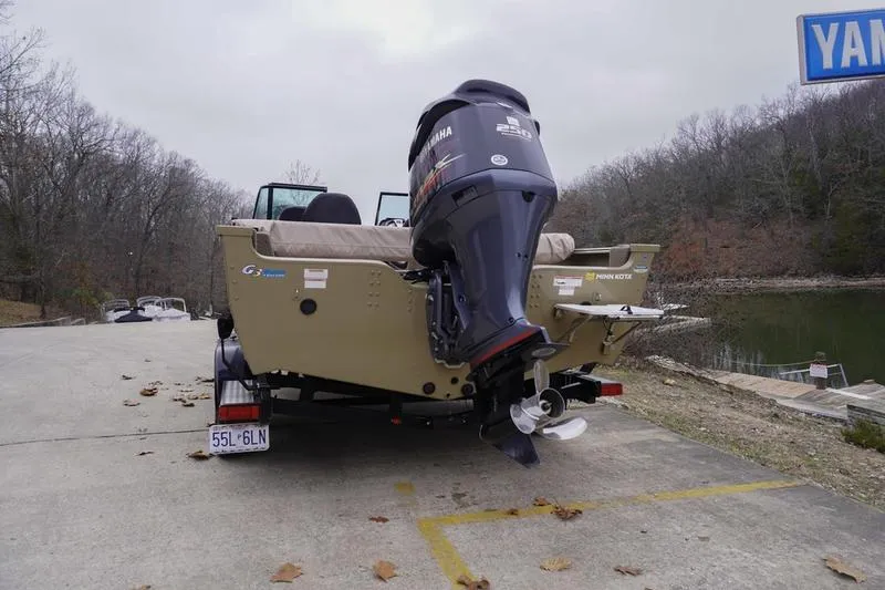 Slide: The Image of 2021 G3 Angler V21 F boat with Yamaha motor on trailer by a lake. - 3