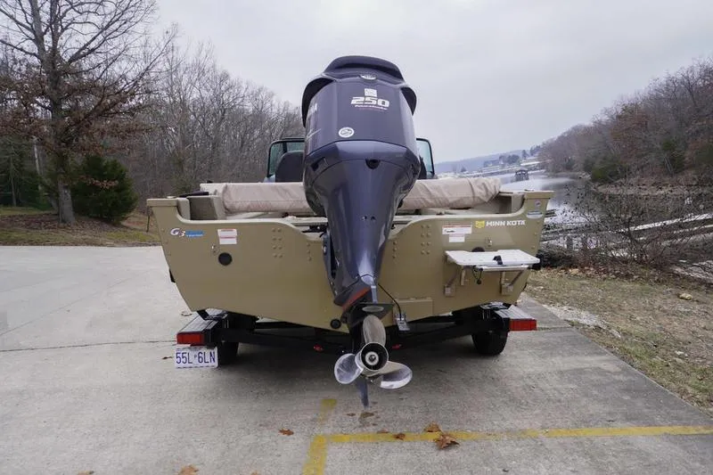 Slide: The Image of 2021 G3 Angler V21 F boat with powerful outboard motor, parked near a lake. - 4