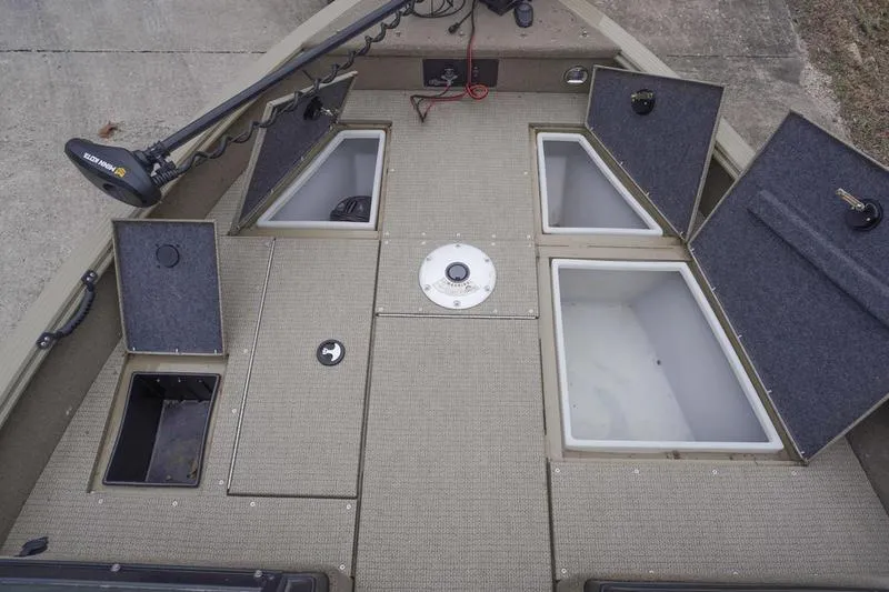 Slide: The Image of 2021 G3 Angler V21 F boat deck with storage compartments open. - 6