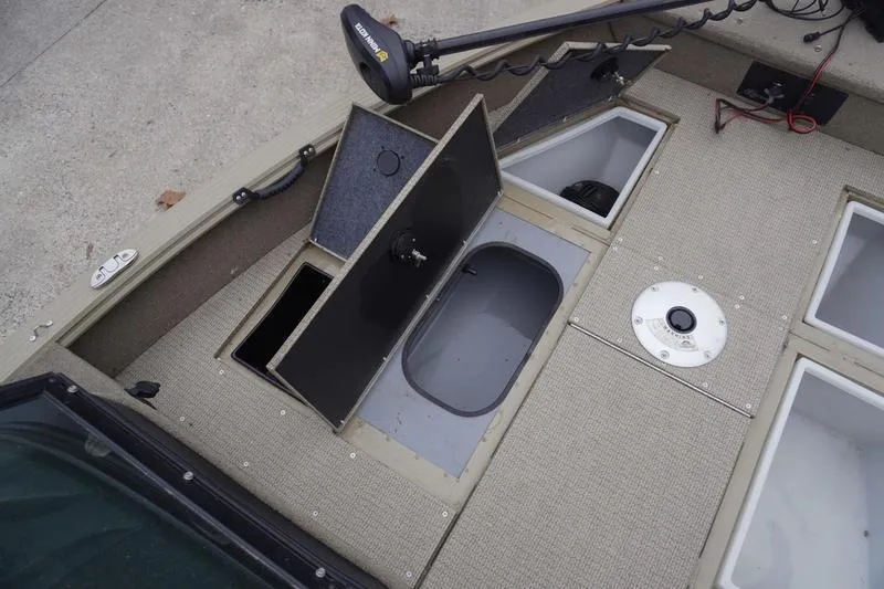 Slide: The Image of 2021 G3 Angler V21 F boat deck with storage compartments and trolling motor. - 8