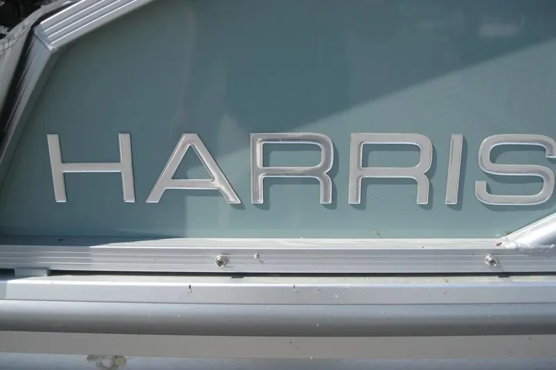 Slide: The Image of 2024 Harris FloteBote Cruiser 230 logo on boat exterior. - 4