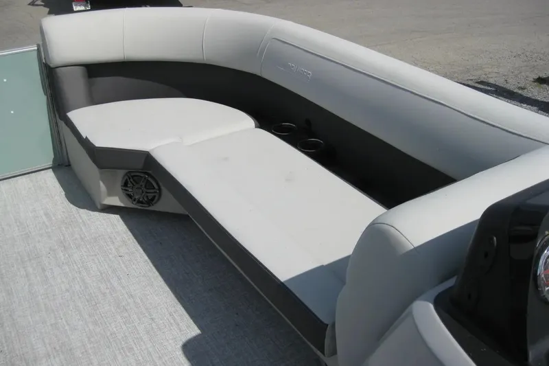 Slide: The Image of 2024 Harris FloteBote Cruiser 230 interior seating with cup holders and speaker. - 8
