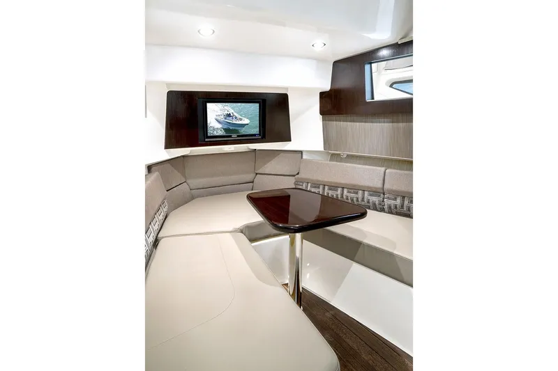Slide: The Image of 2021 Pursuit S 378 Sport boat interior with seating, ocean view, and triple engines. - 13