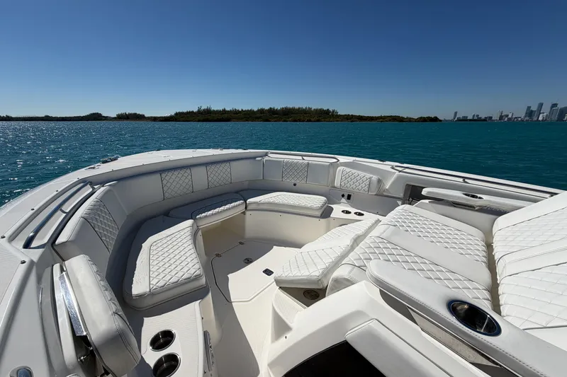 Slide: The Image of 2021 Pursuit S 378 Sport boat with luxurious seating on open water. - 27