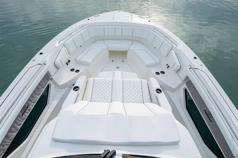 Slide: The Image of 2021 Pursuit S 378 Sport boat on clear blue water, featuring Yamaha engines. - 5