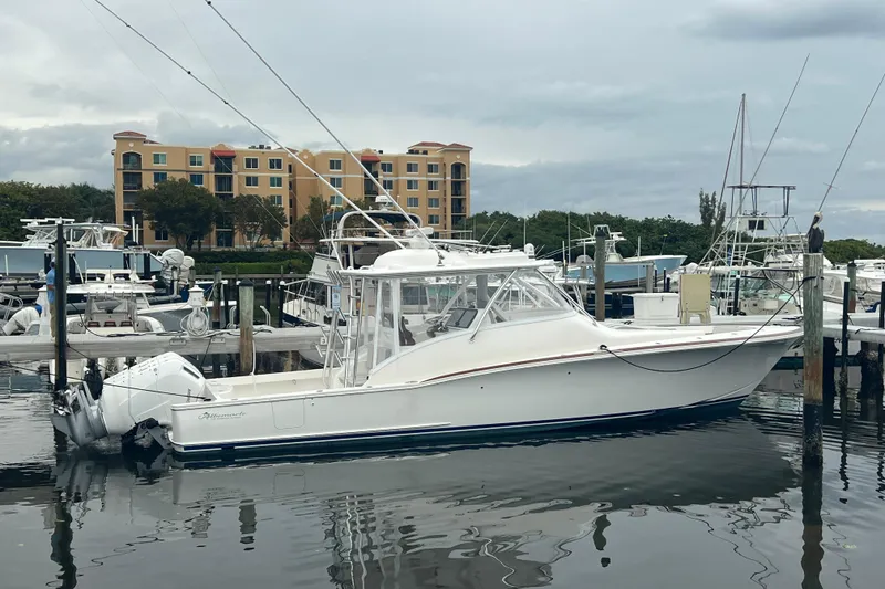 Slide: The Image of 2026 Albemarle 45 Carolinian Fisharound Express docked at marina, with buildings in background. - 6