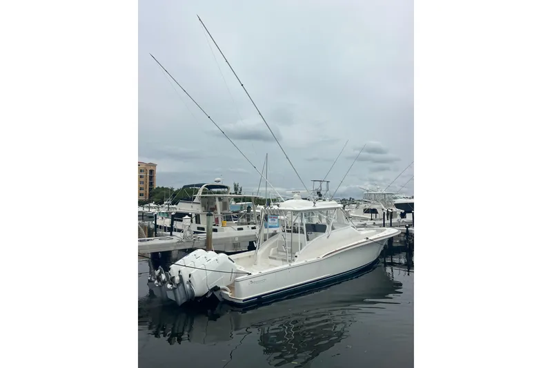 Slide: The Image of 2026 Albemarle 45 Carolinian Fisharound Express docked at marina, overcast sky. - 7