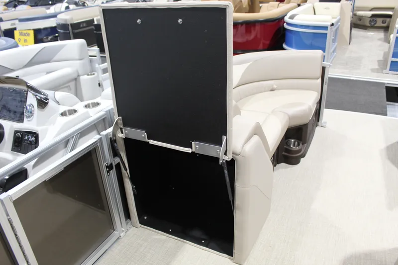 Slide: The Image of 2025 Avalon 2385 25 LSZ QL pontoon boat interior with beige seating and cup holders. - 3