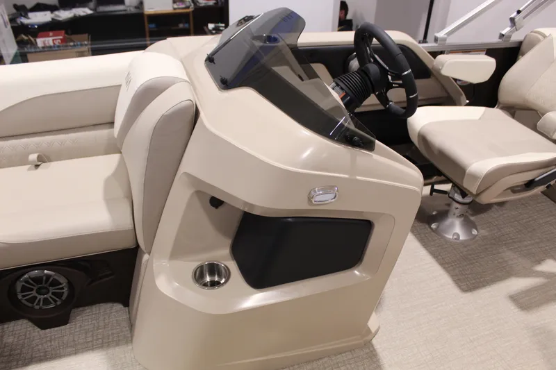 Slide: The Image of 2025 Avalon 2385 25 LSZ QL boat interior with steering console and seating. - 4