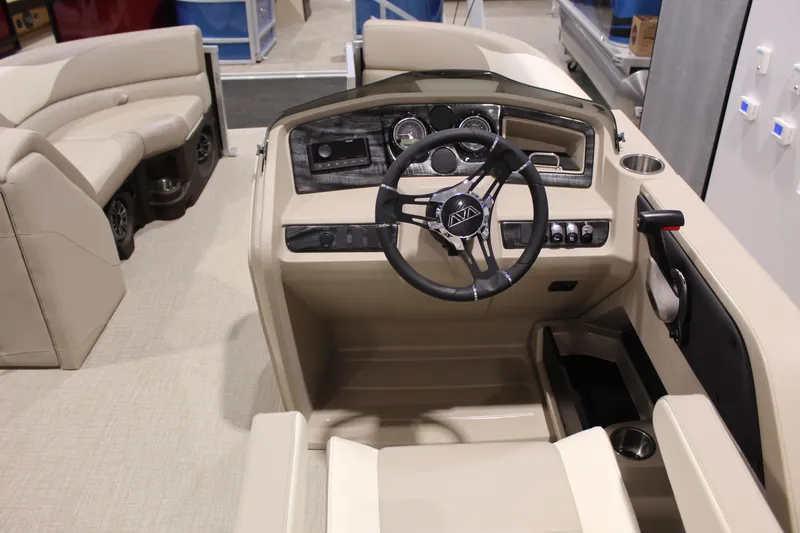 Slide: The Image of 2025 Avalon 2385 25 LSZ QL boat interior with steering wheel and seating. - 5