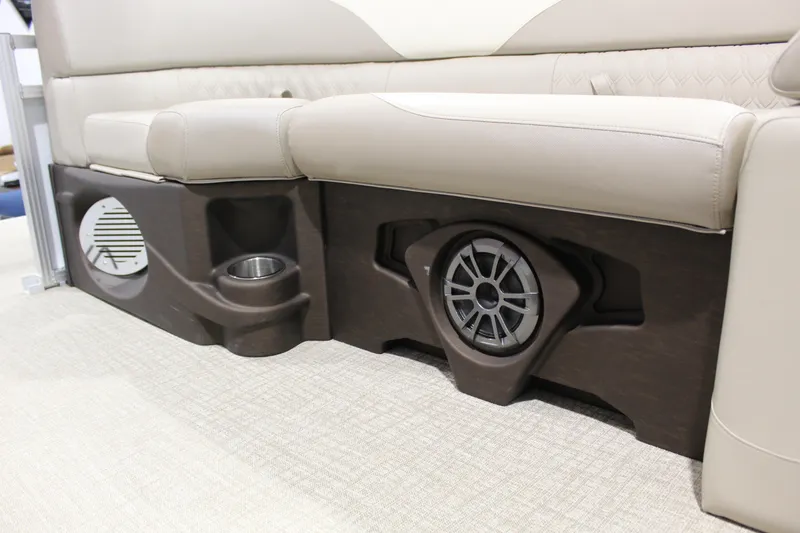 Slide: The Image of 2025 Avalon 2385 25 LSZ QL boat seating with integrated speakers and cup holders. - 9