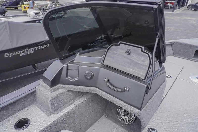 Slide: The Image of 2025 G3 Angler V178 F boat console with windshield and storage compartment. - 10