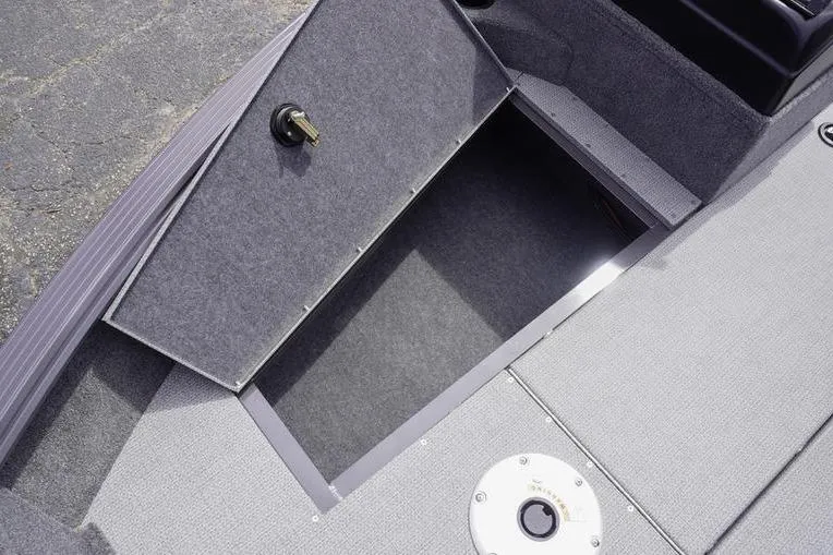 Slide: The Image of 2025 G3 Angler V178 F boat storage compartment with open hatch, gray interior. - 16