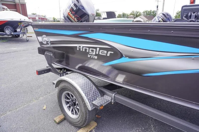 Slide: The Image of 2025 G3 Angler V178 F boat on trailer, featuring sleek design and blue accents. - 3
