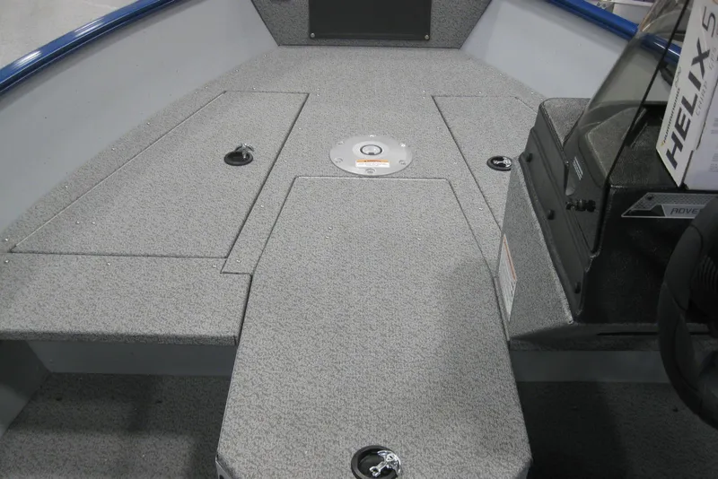 Slide: The Image of 2025 Lund 1675 Adventure SS boat dashboard with steering wheel and control panel. - 13