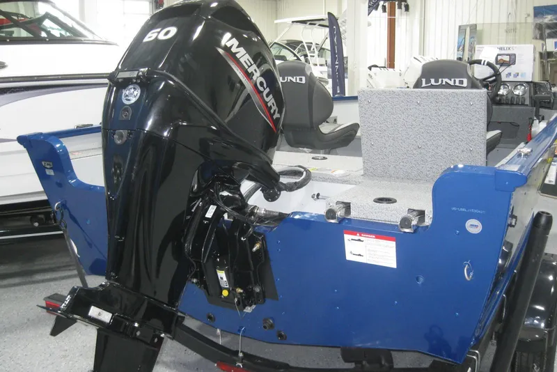 Slide: The Image of 2025 Lund 1675 Adventure SS boat logo on blue background. - 4