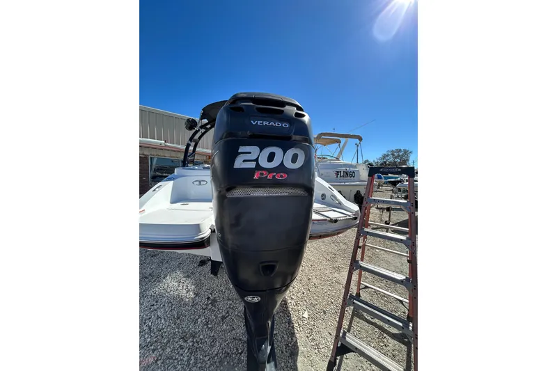 Slide: The Image of 2017 Tahoe 2150 boat with Verado 200 Pro outboard motor in a sunny outdoor setting. - 16