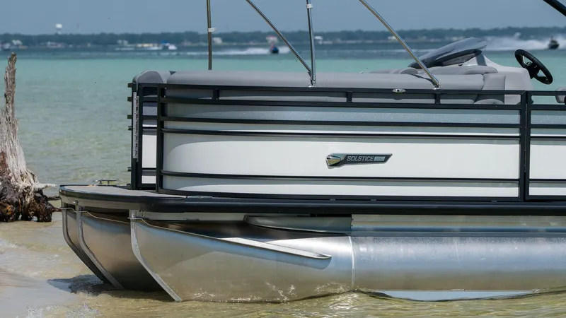 Slide: The Image of Harris Solstice 230 pontoon boat 2026 on the beach. - 8