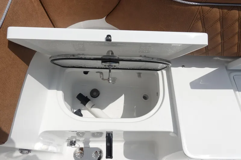 Slide: The Image of 2026 Sea Hunt Ultra 275 Coffin Box boat with tan cushioned seating. - 10