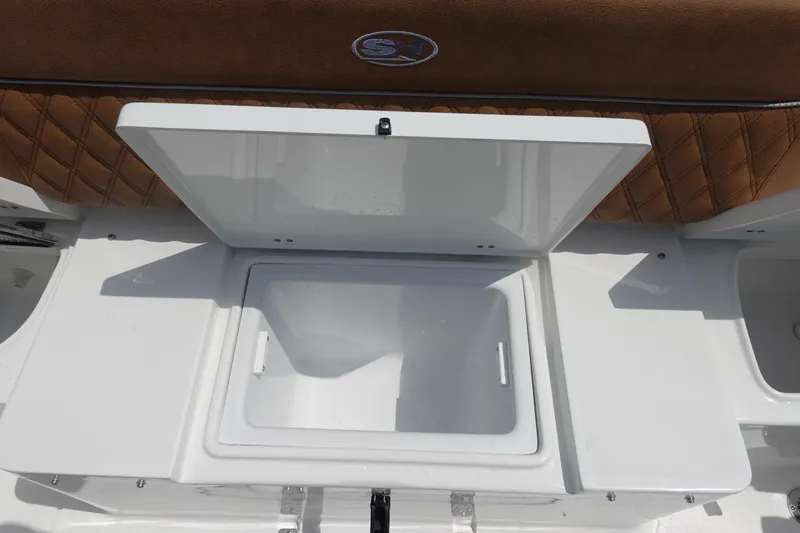 Slide: The Image of 2026 Sea Hunt Ultra 275 Coffin Box with brown quilted seating and storage compartment. - 11