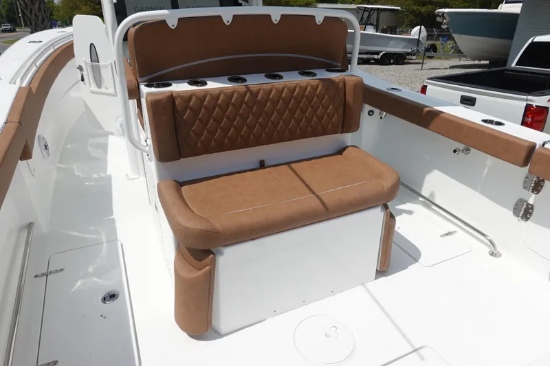 Slide: The Image of Luxurious seating on 2026 Sea Hunt Ultra 275 Coffin Box boat, featuring brown leather upholstery. - 13