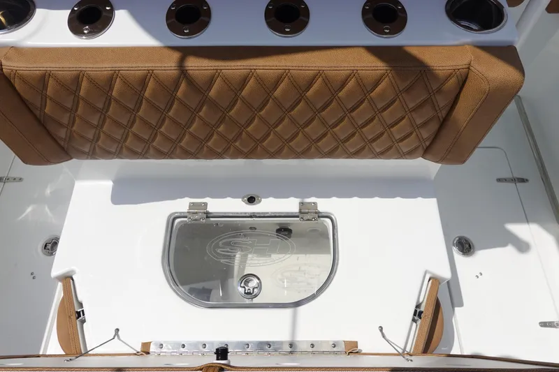 Slide: The Image of 2026 Sea Hunt Ultra 275 Coffin Box boat seats with brown upholstery and diamond stitching. - 14