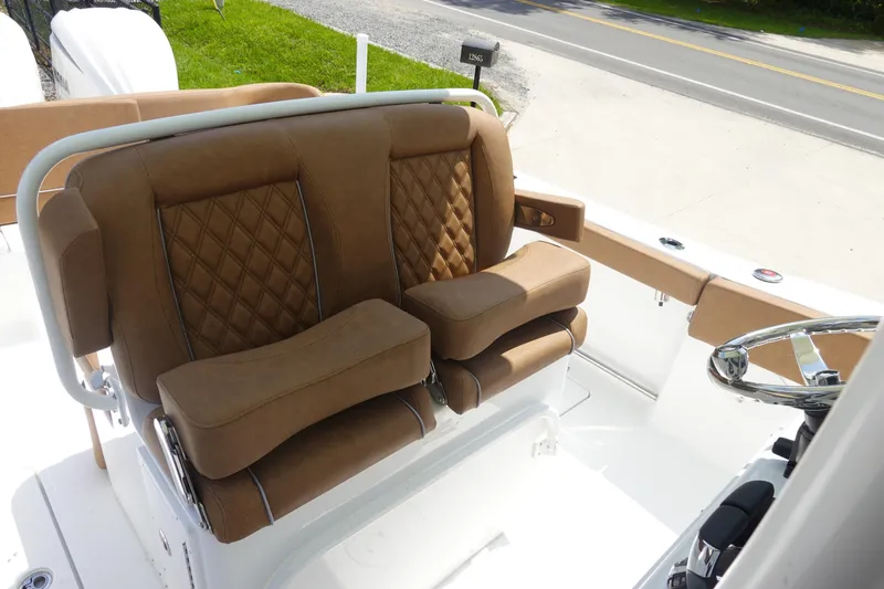 Slide: The Image of 2026 Sea Hunt Ultra 275 Coffin Box helm with dual Garmin displays and steering wheel. - 16