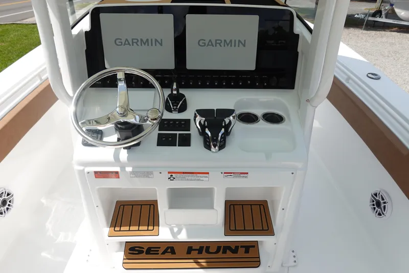 Slide: The Image of 2026 Sea Hunt Ultra 275 Coffin Box boat with brown seating and white deck. - 18
