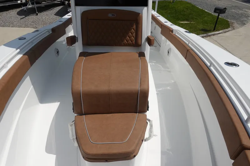 Slide: The Image of 2026 Sea Hunt Ultra 275 Coffin Box interior with open storage compartment. - 20