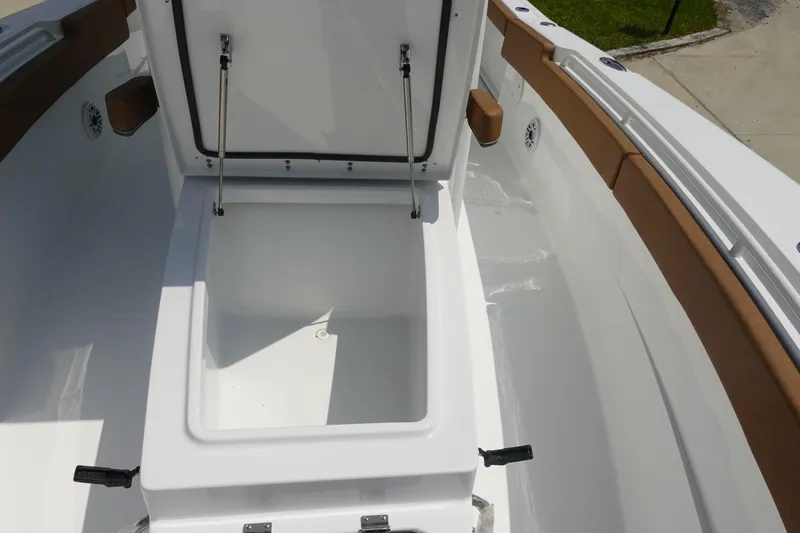 Slide: The Image of Anchor compartment of 2026 Sea Hunt Ultra 275 Coffin Box boat, featuring chain and hardware. - 23