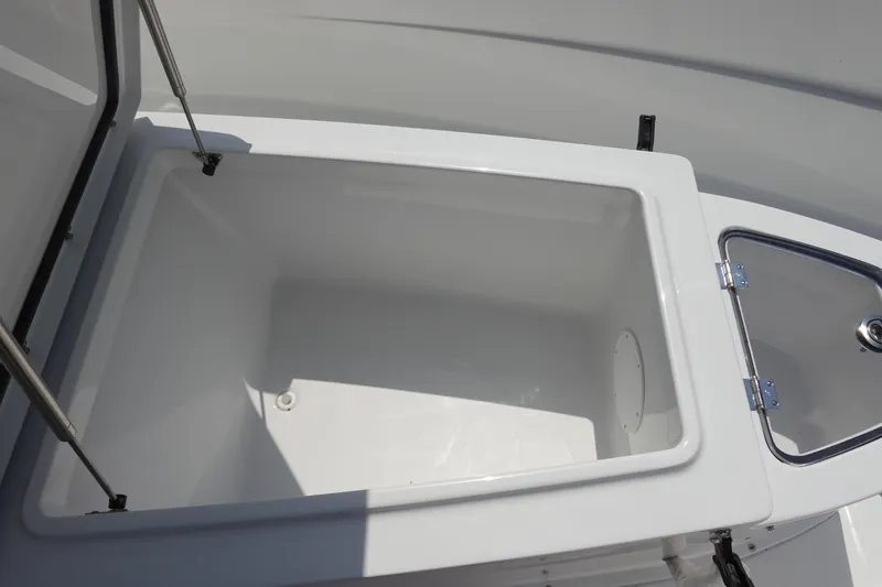 Slide: The Image of Interior of 2026 Sea Hunt Ultra 275 Coffin Box boat with toilet and wooden flooring. - 24