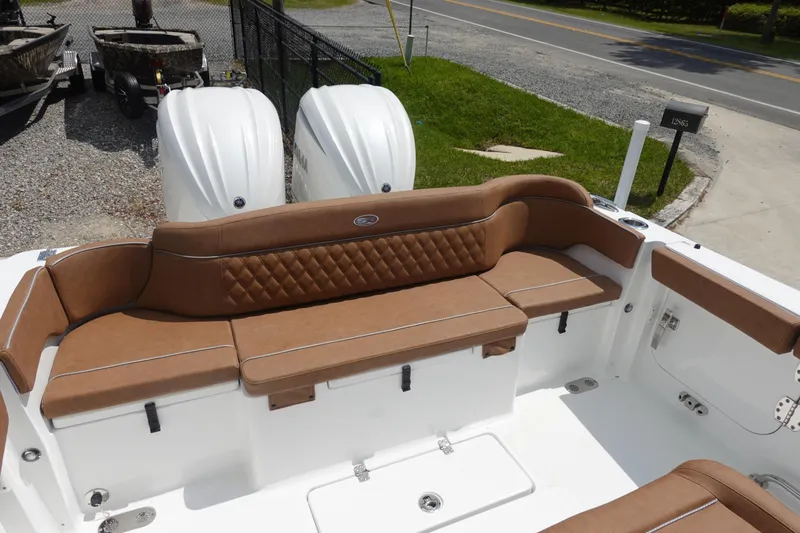 Slide: The Image of Open storage compartment on 2026 Sea Hunt Ultra 275 Coffin Box boat. - 8