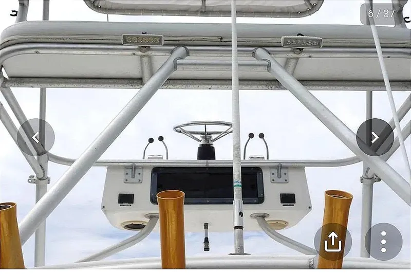 Slide: The Image of View of the helm on a 1997 Pursuit 3000 Express boat. - 4