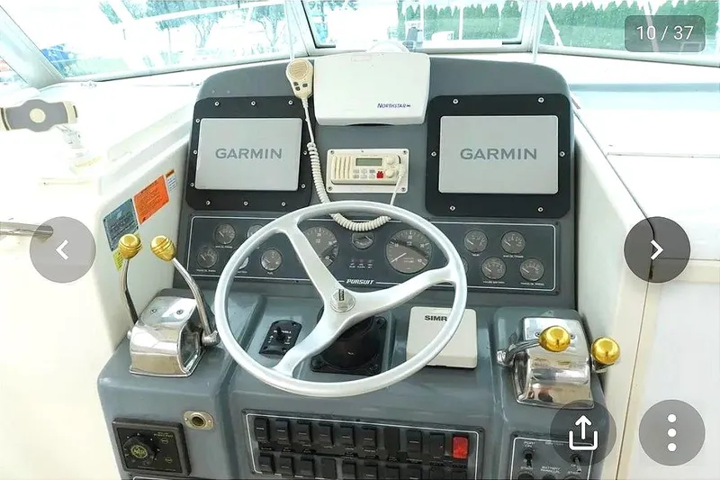 Slide: The Image of Helm of a 1997 Pursuit 3000 Express boat. - 5