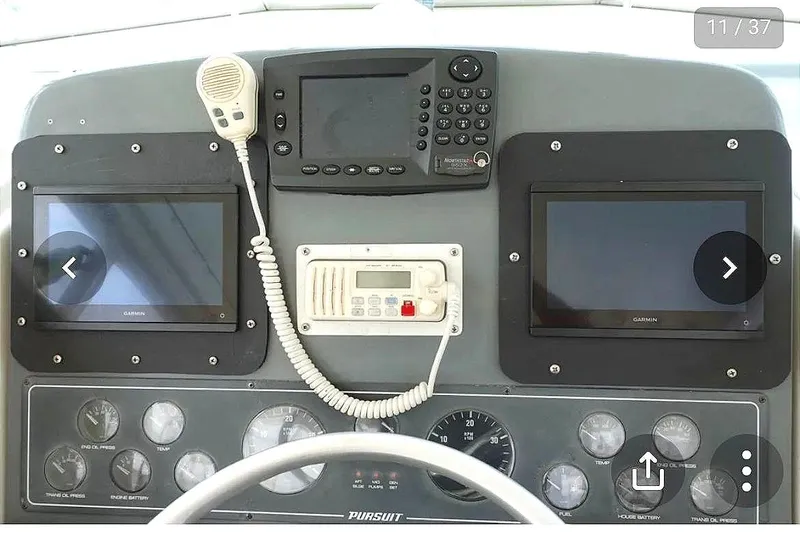 Slide: The Image of Helm console of a 1997 Pursuit 3000 Express boat. - 6