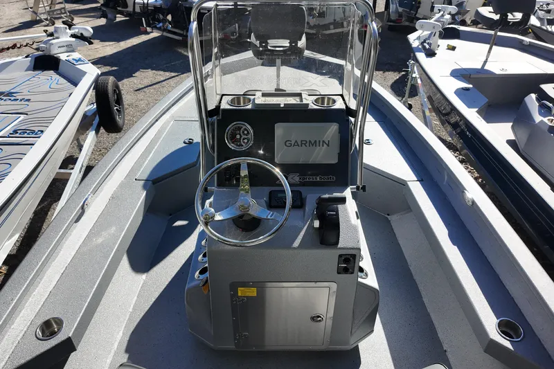 Slide: The Image of 2026 Xpress H20B Bay boat interior with Garmin navigation system and steering console. - 5