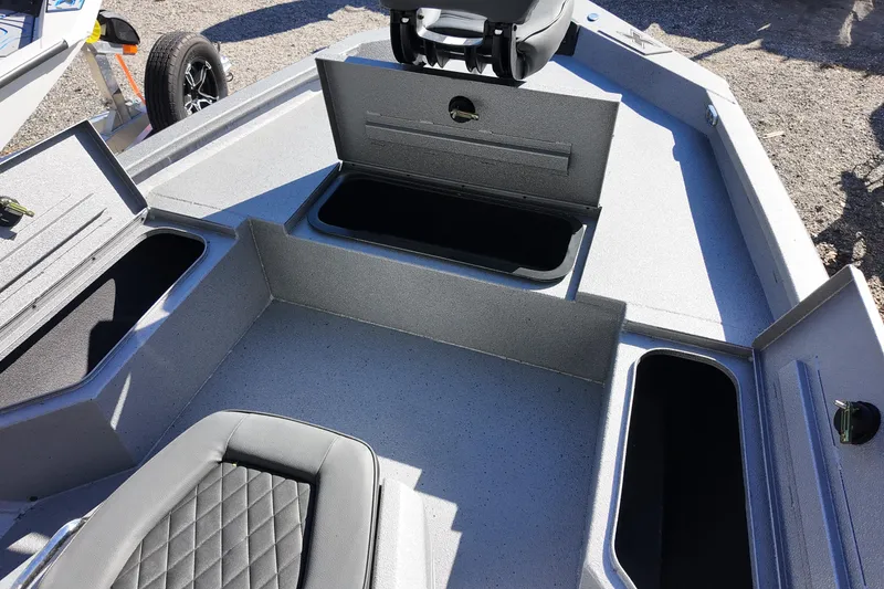 Slide: The Image of 2026 Xpress H20B Bay boat interior with open storage compartments and seating. - 7