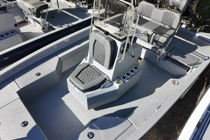 Slide: The Image of 2026 Xpress H20B Bay boat interior with seating and console. - 9