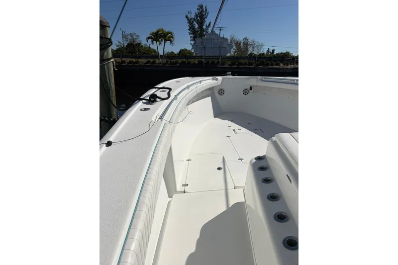 Slide: The Image of 2009 Yellowfin 42 Offshore boat deck with seating and rod holders. - 11