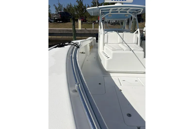 Slide: The Image of 2009 Yellowfin 42 Offshore boat interior with seating and deck view. - 18