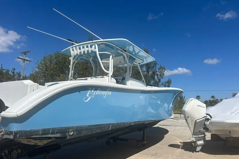 Slide: The Image of 2009 Yellowfin 42 Offshore boat with blue hull and Mercury outboard motor. - 2