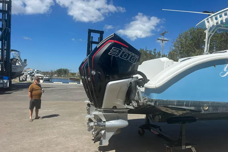Slide: The Image of 2009 Yellowfin 42 Offshore boat with powerful outboard engine on a sunny day. - 3