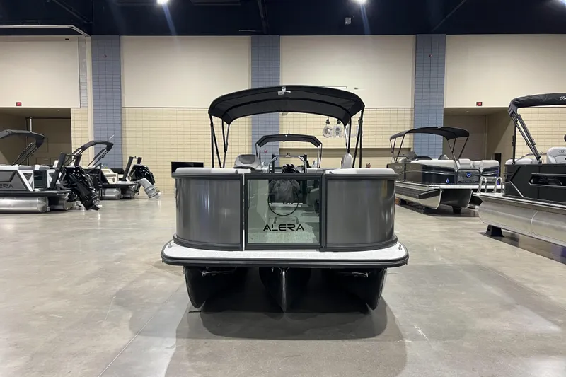 Slide: The Image of 2026 Alera A22Q pontoon boat displayed indoors, showcasing sleek design and modern features. - 2