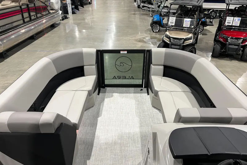 Slide: The Image of Luxurious 2026 Alera A22Q pontoon boat interior with plush seating in showroom. - 5