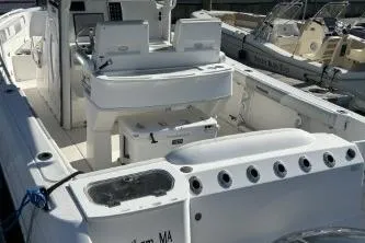 Slide: The Image of 2013 Everglades 275 Center Console boat with spacious deck and seating. - 6